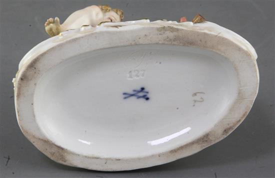 A Meissen figure of Cupid making a cup of hot chocolate, 19th century 10.6cm, slight restorations
